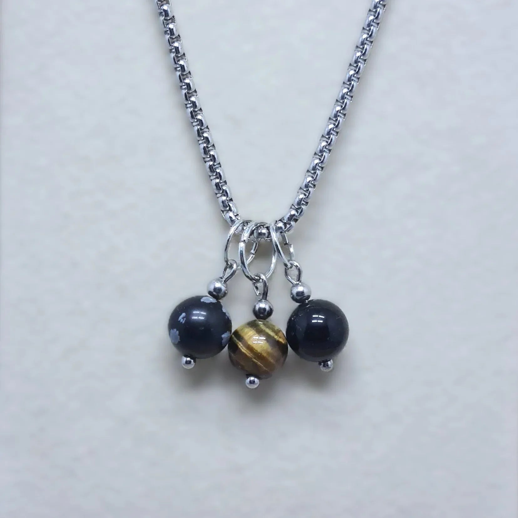 Collier 3 perles : Obsidienne mouchetée, Œil de Tigre et Obsidienne Œil Céleste - ENAE Minéraux