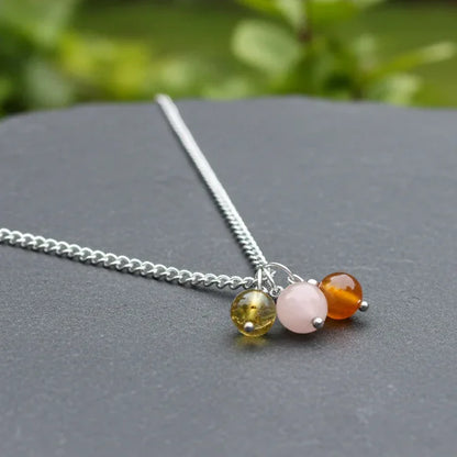 Collier 3 perles : Ambre, Pierre de Lune pêche et Cornaline - ENAE Minéraux